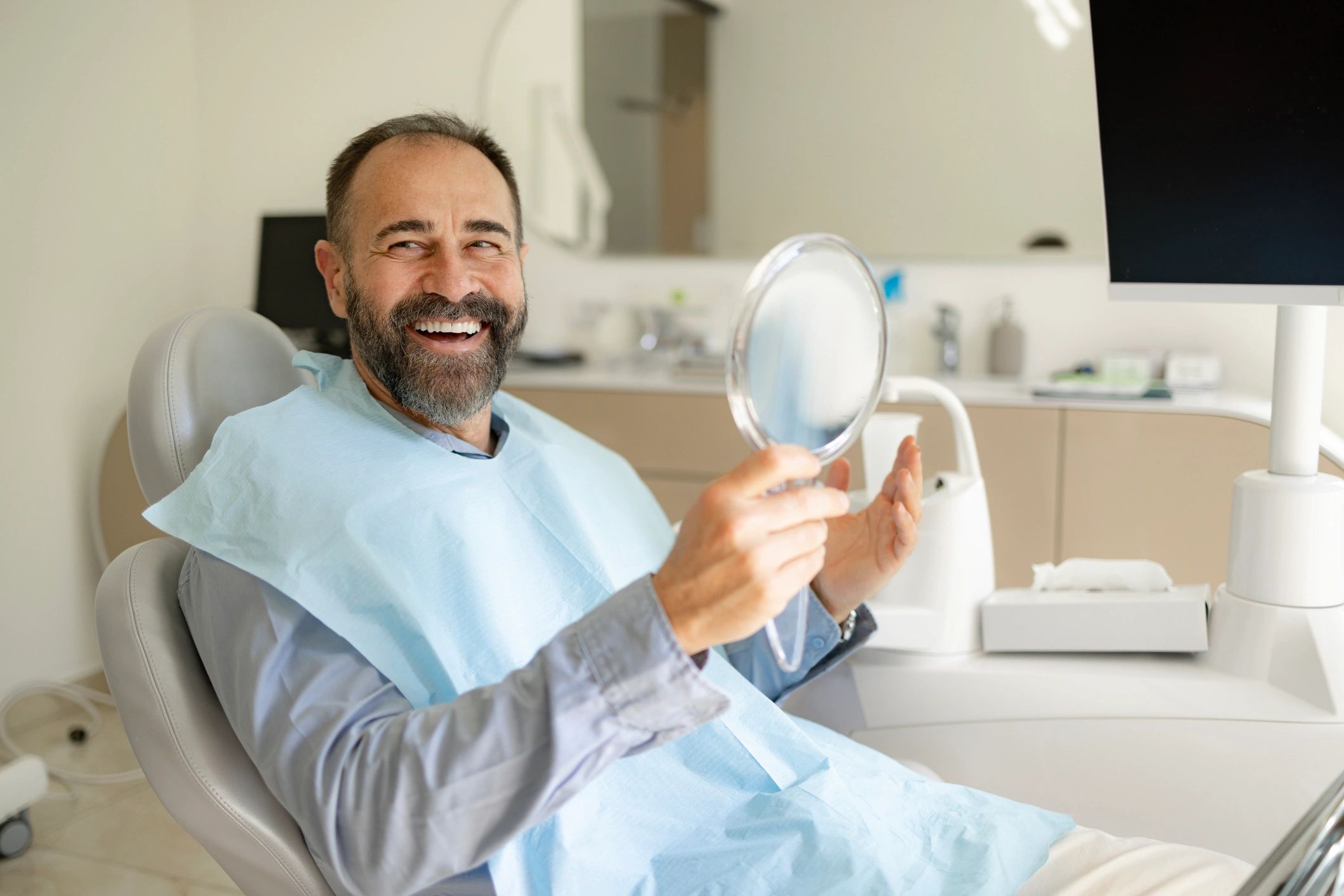 Patient smiling after dental care in a clinic