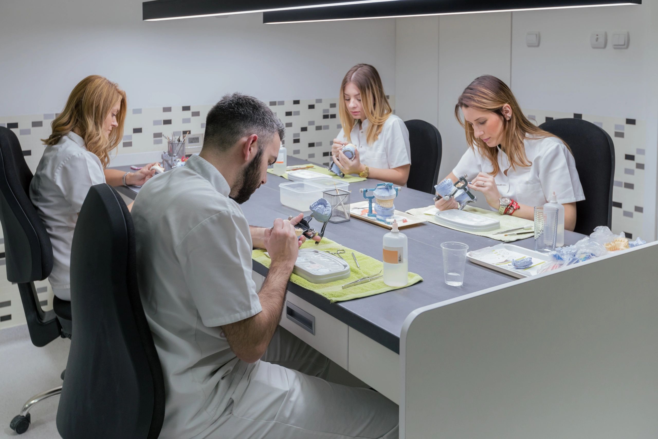 Dental technicians collaborating in the laboratory